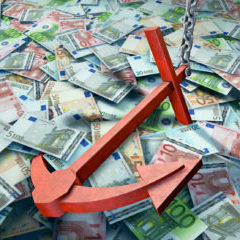 Red Anchor Resting on Pile of Euro Bills
